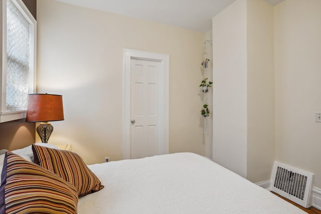 bedroom with visible vents and baseboards