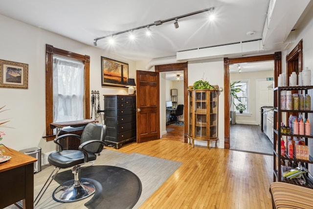 interior space with track lighting and light wood-type flooring