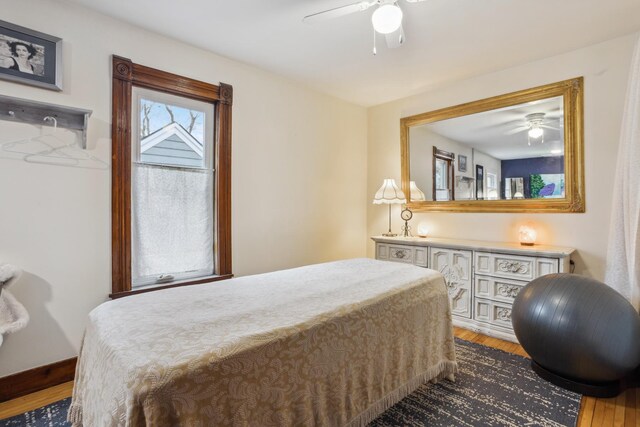bedroom featuring a ceiling fan and wood finished floors