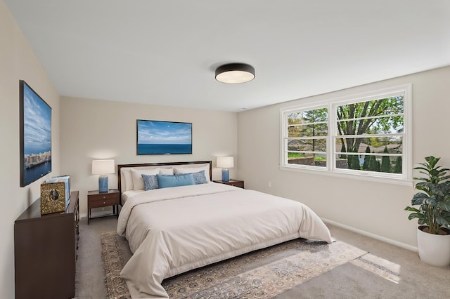 bedroom with carpet and baseboards