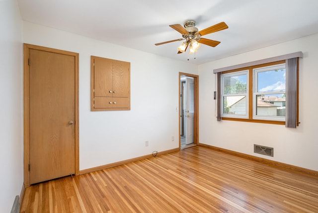 4926 Madison St NE, Columbia Heights, MN 55421 - spare room featuring light wood-style flooring and ceiling fan