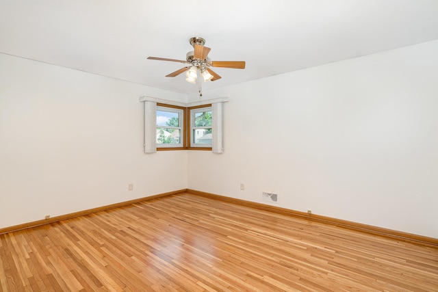 4926 Madison St NE, Columbia Heights, MN 55421 - unfurnished room with ceiling fan and light wood-type flooring