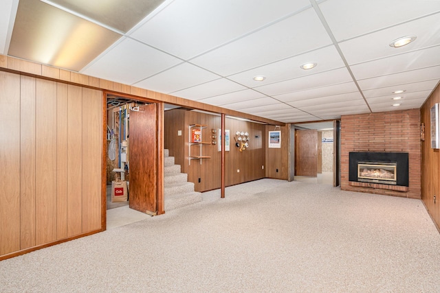 4926 Madison St NE, Columbia Heights, MN 55421 - finished below grade area with a brick fireplace, wooden walls, carpet, stairs, and recessed lighting