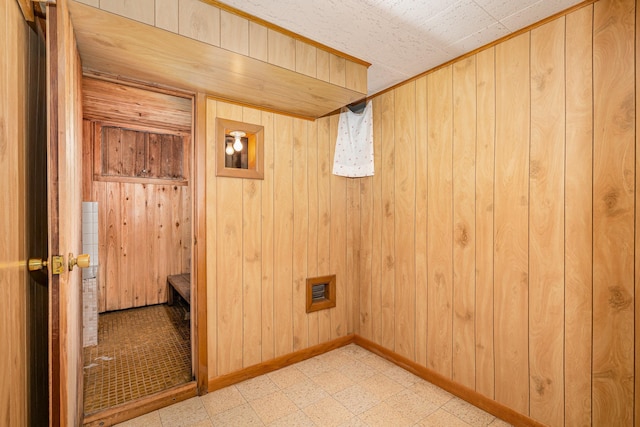 4926 Madison St NE, Columbia Heights, MN 55421 - laundry room featuring tile patterned floors and wood walls
