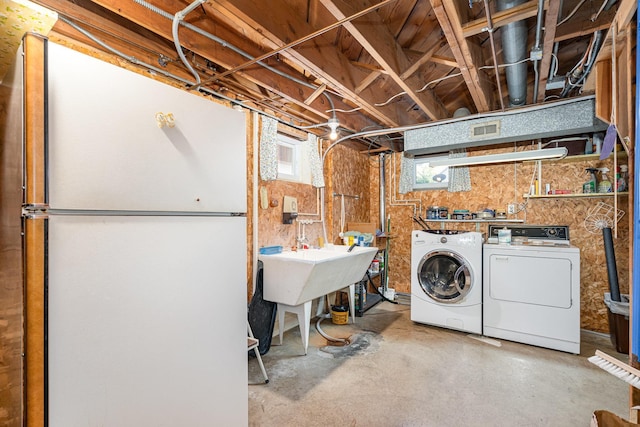 4926 Madison St NE, Columbia Heights, MN 55421 - laundry area with independent washer and dryer and a workshop area
