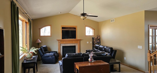 22922 Silverod St NW, Saint Francis, MN 55070 - carpeted living area featuring a fireplace, visible vents, a wealth of natural light, and ceiling fan