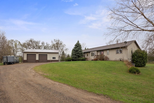 17471 165th St SE, Big Lake, MN 55309 - view of front of home featuring an outbuilding, driveway, a front yard, and a garage