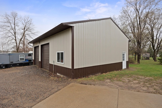 17471 165th St SE, Big Lake, MN 55309 - view of side of home with a garage and an outbuilding