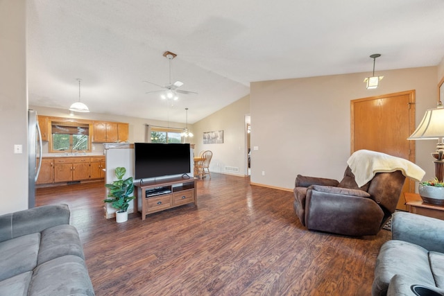 17471 165th St SE, Big Lake, MN 55309 - living area featuring dark wood-style floors, a ceiling fan, lofted ceiling, and baseboards