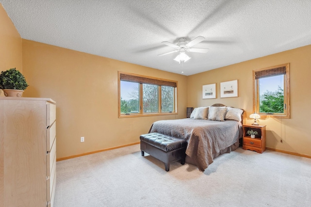 17471 165th St SE, Big Lake, MN 55309 - bedroom featuring light colored carpet, baseboards, a textured ceiling, and a ceiling fan