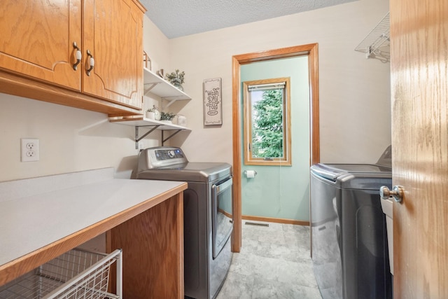 17471 165th St SE, Big Lake, MN 55309 - laundry room with cabinet space, washer and dryer, and baseboards