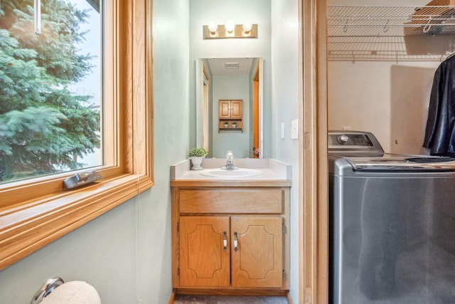 17471 165th St SE, Big Lake, MN 55309 - bathroom featuring washer / clothes dryer and vanity