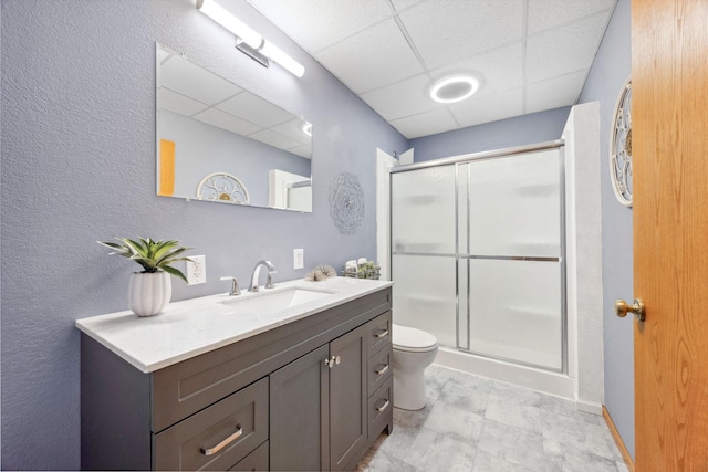 17471 165th St SE, Big Lake, MN 55309 - bathroom with a paneled ceiling, a stall shower, vanity, toilet, and a textured wall