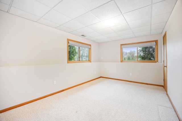 17471 165th St SE, Big Lake, MN 55309 - carpeted spare room featuring healthy amount of natural light, a paneled ceiling, and baseboards