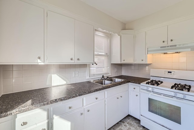kitchen with a sink, under cabinet range hood, white cabinetry, backsplash, and white gas range oven