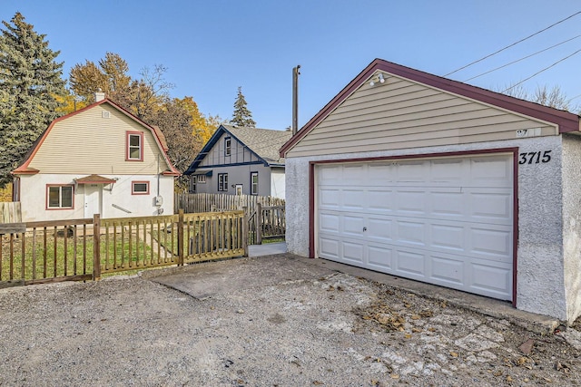 detached garage with fence