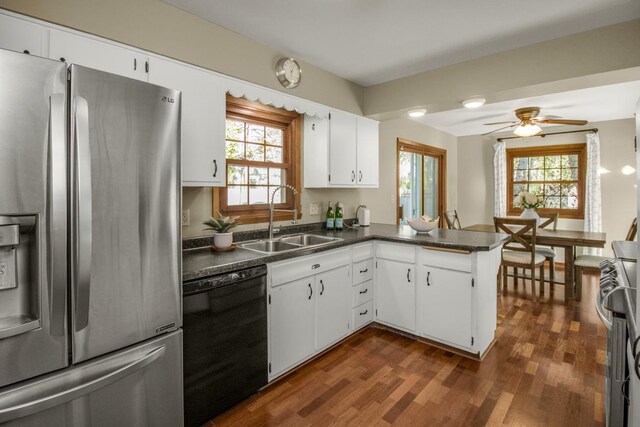 kitchen with stainless steel refrigerator with ice dispenser, dishwasher, a sink, dark wood-style flooring, and ceiling fan