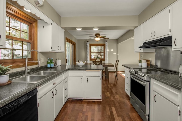 kitchen with dishwasher, under cabinet range hood, stainless steel range with electric stovetop, a sink, and dark wood finished floors