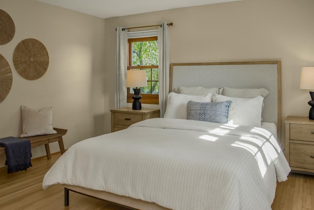 bedroom featuring light wood-style floors