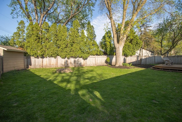 view of yard with a wooden deck