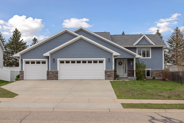 view of front of home with a garage, concrete driveway, and stone siding