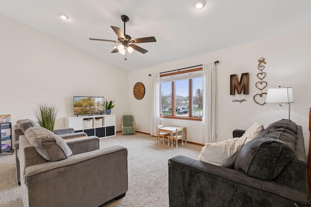 living room with vaulted ceiling, light colored carpet, a ceiling fan, and baseboards