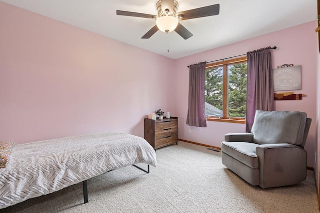 bedroom featuring carpet floors, baseboards, and a ceiling fan
