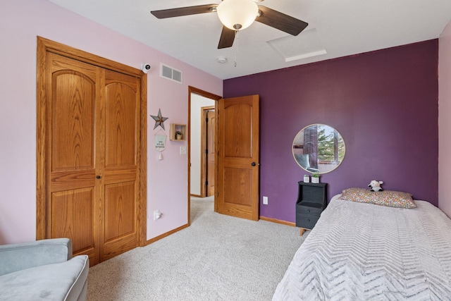 bedroom featuring light carpet, baseboards, and a ceiling fan