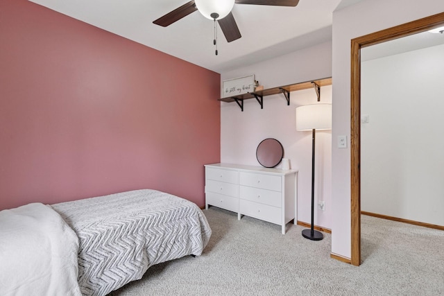 bedroom featuring carpet flooring, baseboards, and a ceiling fan