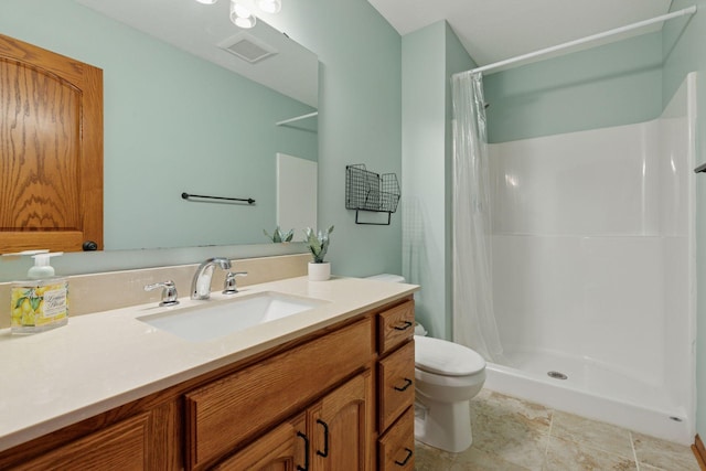 full bath with toilet, a stall shower, and vanity