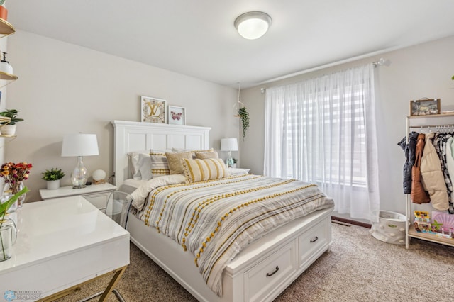 bedroom featuring light colored carpet