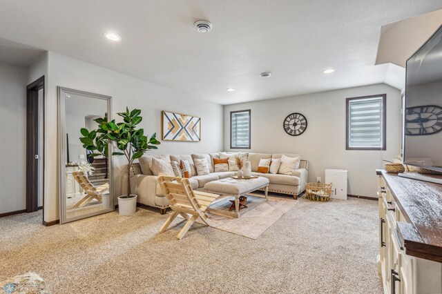 living area featuring light carpet, a wealth of natural light, baseboards, and recessed lighting