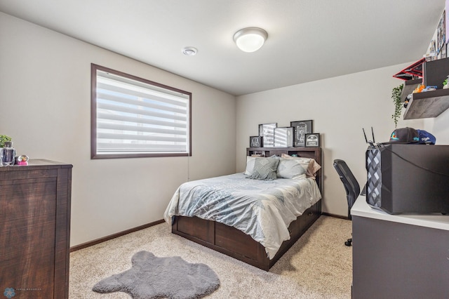 carpeted bedroom with baseboards