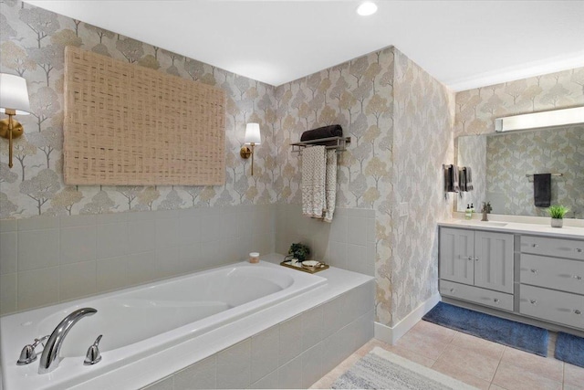 2041 Oak St, Lake City, MN 55041 - full bathroom with tile patterned floors, a garden tub, vanity, and baseboards