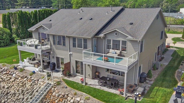 2041 Oak St, Lake City, MN 55041 - back of property with a patio, outdoor lounge area, a wooden deck, and roof with shingles