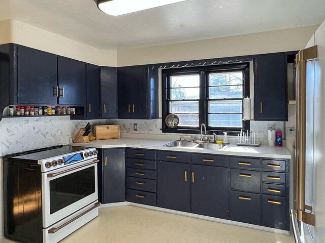 305 Kneale Ave N, Thief River Falls, MN 56701 - kitchen with tasteful backsplash, electric stove, light countertops, and a sink