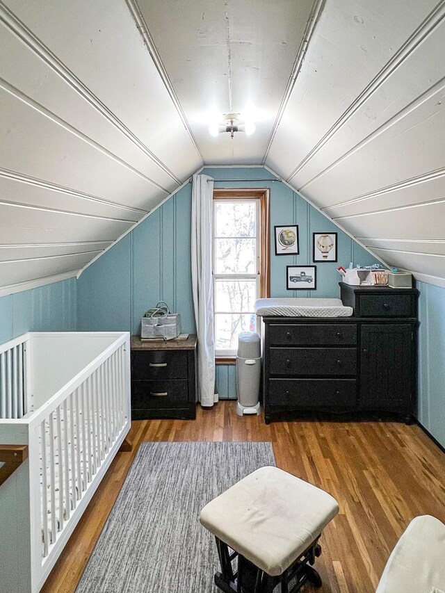 305 Kneale Ave N, Thief River Falls, MN 56701 - bedroom featuring vaulted ceiling and wood finished floors