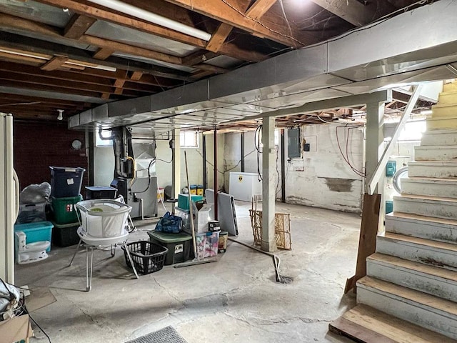 305 Kneale Ave N, Thief River Falls, MN 56701 - below grade area with electric panel, stairway, and heating unit
