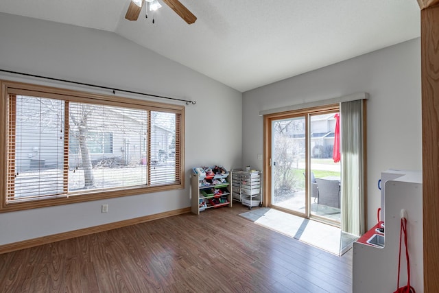 505 Welco Ln W, Montgomery, MN 56069 - interior space featuring lofted ceiling, a ceiling fan, wood finished floors, and baseboards