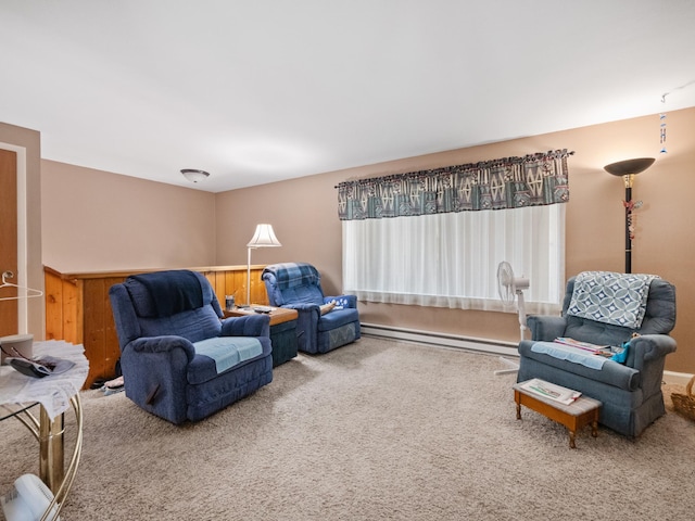living room with baseboard heating and carpet