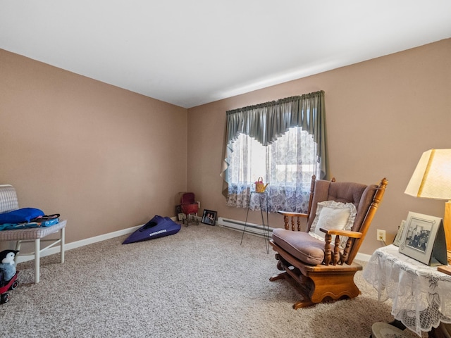 living area with carpet flooring, a baseboard heating unit, and baseboards