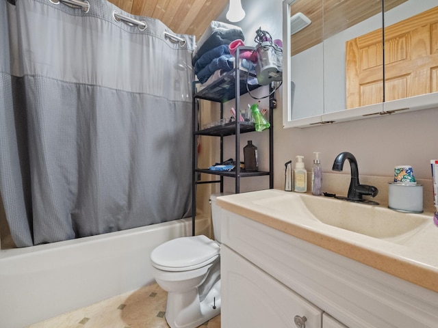 bathroom with shower / bath combo with shower curtain, vanity, and toilet