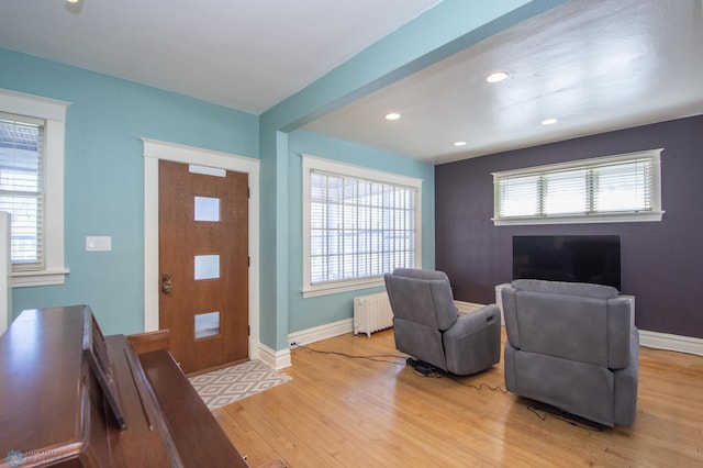 708 1st St N, Fargo, ND 58102 - entryway with baseboards, plenty of natural light, light wood finished floors, and radiator