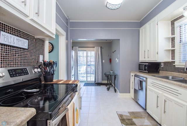 708 1st St N, Fargo, ND 58102 - kitchen with white cabinets and appliances with stainless steel finishes