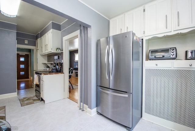 708 1st St N, Fargo, ND 58102 - kitchen with white cabinets, stainless steel appliances, and light tile patterned floors
