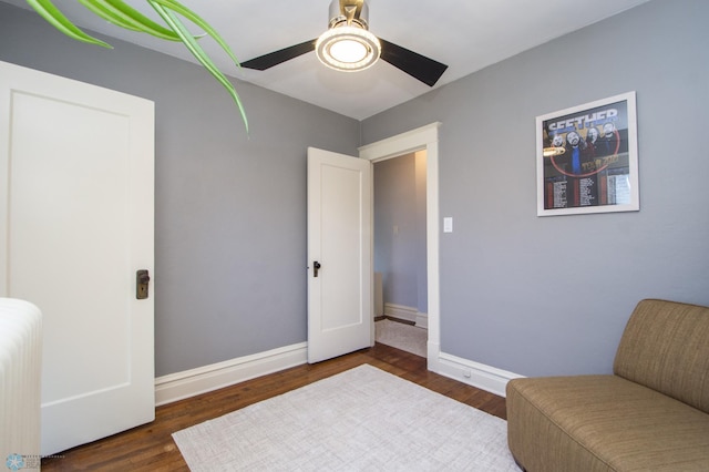 708 1st St N, Fargo, ND 58102 - living area with baseboards, a ceiling fan, wood finished floors, and radiator