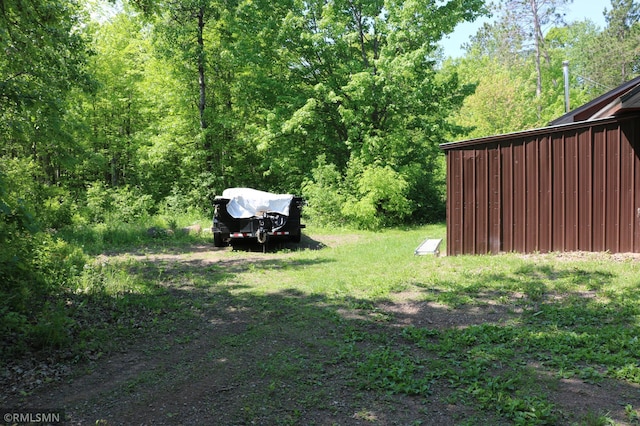 14638 State Highway 70, Pine City, MN 55063 - view of yard with a view of trees, an outdoor structure, and an outbuilding