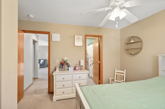 bedroom featuring light colored carpet and ceiling fan