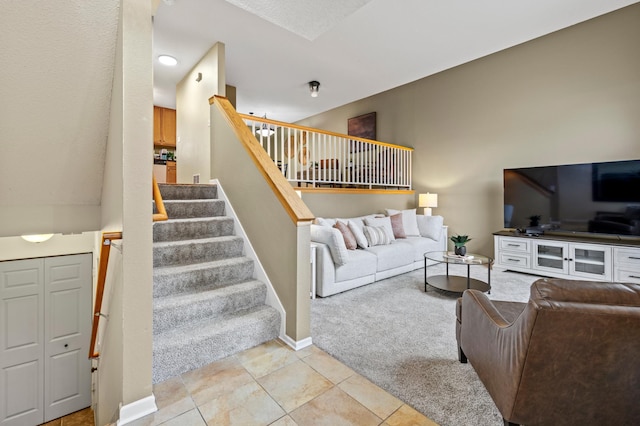 6491 Regency Ln, Eden Prairie, MN 55344 - living area featuring light colored carpet, stairs, and light tile patterned flooring