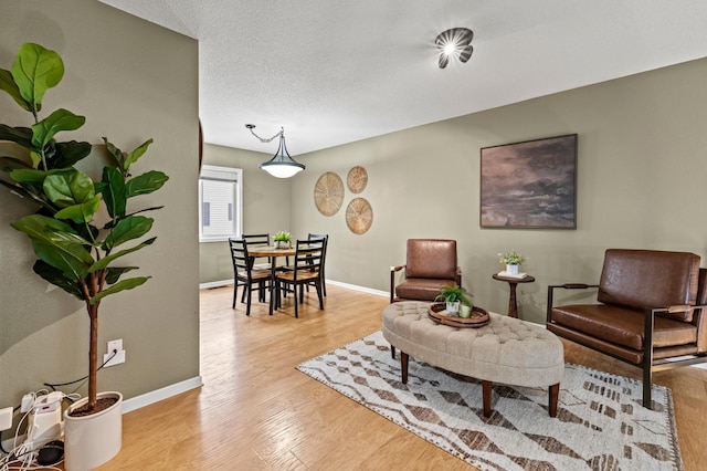 6491 Regency Ln, Eden Prairie, MN 55344 - sitting room with light wood finished floors and baseboards